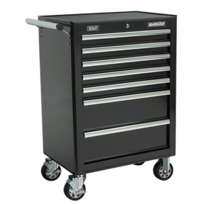 The Sealey Rollcab 7 Drawer with Ball-Bearing Slides - Black - AP26479TB is a black rolling tool chest featuring seven metal drawers. It has the "Sealey" branding on the top left and "Superline Pro" on the top right. The chest boasts heavy-duty ball-bearing drawer slides and a rust-resistant powder coat for enhanced durability. Equipped with four swivel casters for easy mobility, this tool chest also comes with a 5-year guarantee.