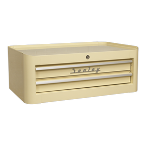 The Sealey Mid-Box 2 Drawer Retro Style - AP28102 is a beige tool chest that features a retro mid-box design and ball-bearing slides for smooth operation. The front lock ensures your tools are secure, while the Lift & Latch drawer pulls add a touch of convenience.