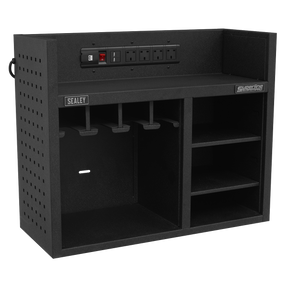The Sealey Power Tool Storage Rack with Power Strip - AP30SRBE is a black wall-mounted tool organizer featuring multiple compartments, four storage slots, and an integrated power strip with four outlets and a switch. Ideal for power tool storage, it keeps your workshop tidy and efficient.