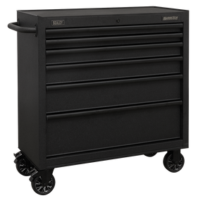 The Sealey Rollcab 6 Drawer 915mm with Soft Close Drawers - AP3606BE is a black rolling tool chest equipped with six drawers and a side handle, perfect for organizing and storing tools. Made from heavy-duty steel construction, it boasts ball-bearing drawer slides for smooth operation and a rust-resistant finish to ensure long-lasting durability.