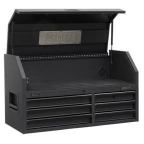 The Sealey Topchest 6 Drawer 1030mm with Soft Close Drawers & Power Strip - AP4106BE has an open lid that reveals a spacious upper compartment featuring the Sealey logo, along with six closed drawers underneath. Constructed from heavy-duty steel, it includes ball-bearing drawer slides and side handles for portability.