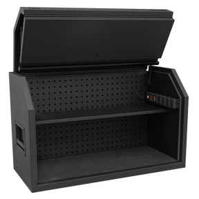 The Sealey Toolbox Hutch 1030mm with Power Strip - AP41HBE is a black, open tool storage cabinet featuring a pegboard back, a middle shelf, and built-in electrical outlets on the right side. Constructed from heavy gauged steel for enhanced durability, this hutch-style toolbox also includes a power strip for added convenience.
