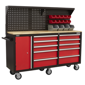 The Sealey Mobile Workstation 10 Drawer with Backboard - AP6310 is a large, red and black rolling tool chest that features a wooden worktop, multiple drawers, and a pegboard equipped with storage bins and shelves. This heavy-duty cabinet provides the durability needed for any workshop.