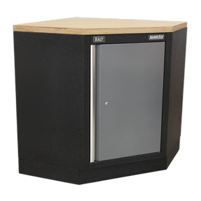 The Modular Corner Floor Cabinet 865mm - APMS60 by Sealey is a black steel cabinet with a wooden top and one gray front door, featuring an adjustable shelf, perfect for any garage storage system.