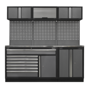 The Sealey Superline PRO® Storage System - Stainless Steel Worktop (Model: APMSSTACK11SS) is a gray metal workbench equipped with multiple storage compartments, including drawers with ball-bearing slides, cabinets, and a perforated back panel for optimal tool organization. The stainless steel worktop provides durability and easy cleaning.