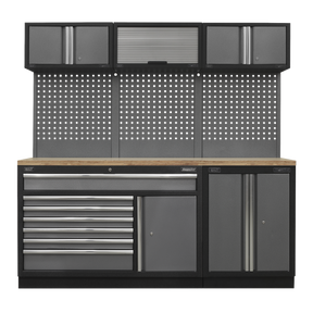 Introducing the Sealey Superline PRO® Storage System (APMSSTACK11W) - a versatile workbench featuring multiple drawers, cabinets, and a tool pegboard. This system includes ball-bearing drawer slides and upper storage with both hinged and roll-up doors. It boasts a pressed wood worktop countertop in an elegant black and gray color scheme.