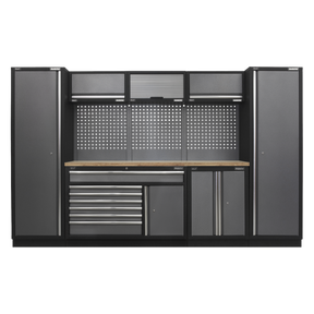 The Superline PRO® 3.24m Storage System - Pressed Wood Worktop - APMSSTACK13W by Sealey is a large metal storage solution that includes pegboards, cabinets, a wooden workbench, and multiple drawers with ball-bearing slides for smooth operation. Its tough and durable construction ensures longevity and reliability in any workspace, making it perfect for organizing tools and equipment.