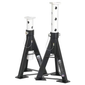 Two Sealey Axle Stands (Pair) with a 12-tonne capacity per stand, model AS12, are positioned side by side. Designed for vehicle support during maintenance, these black and white adjustable heavy-duty stands feature a robust welded steel construction for reliable performance.