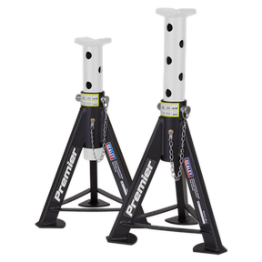 Two welded steel car jack stands labeled "Sealey Axle Stands (Pair) 6 Tonne Capacity per Stand - White," featuring heavy-duty, adjustable columns and safety chains. These stands are designed for maximum stability and reliability.