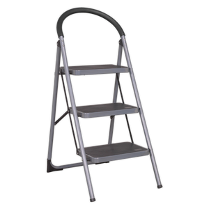 The Sealey Step Stool 3-Tread 150kg Capacity EN 14183 - ASL23 features a black and silver metal frame, anti-slip treads, and a curved handle at the top.