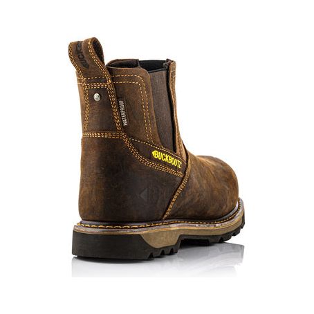 A single Buckler - Buckflex Waterproof Safety Dealer Boot with a 3-way Buckflex Stretch Collar (B1180) in brown leather, shown from the back angle, featuring a pull tab, contrast stitching, a yellow "Buckbootz" label, and an aluminium toecap.