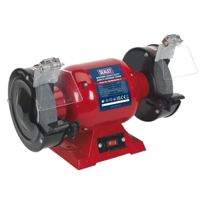 The Sealey Bench Grinder Ø150mm 450W/230V Heavy-Duty - BG150XD/99 features a red and black design, dual aluminous oxide grinding stones, and clear protective shields. It includes an on/off switch at the base, a copper-wound induction motor for improved efficiency, and bears the Sealey brand label on the body—making it ideal for general workshop grinding tasks.