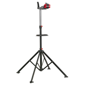 Introducing the Sealey Workshop Bicycle Stand - BS103: a heavy-duty bicycle stand with an adjustable work height. It features a sleek black tripod design and red knobs for securing equipment, along with a rubber-coated frame clamp and a stable base with three extendable legs.