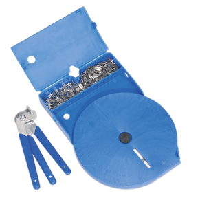 The CVJ Boot Universal Clamp Kit - BSL102 by Sealey includes a blue plastic case containing metal fasteners and a label dispenser roll, alongside a set of distinctive blue-handled crimping tools, ideal for your stainless steel banding needs.