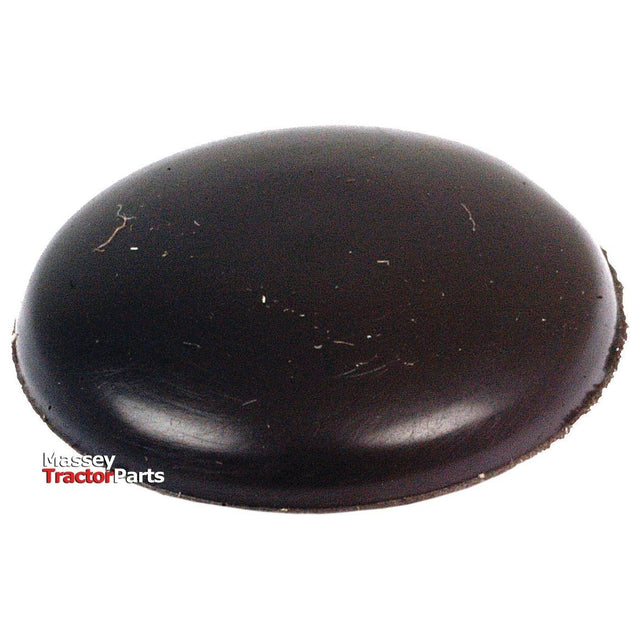 A black, circular tractor part bearing the words "Massey Tractor Parts" partially visible on the lower left side. The surface appears slightly scuffed, reminiscent of a Sparex Blind Grommet Ø7/16'' x 1/16'' Groove (Part No. S.11344).