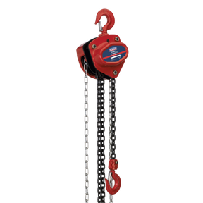 The Sealey Chain Block 1 Tonne 2.5m - CB1000 is a red manual chain hoist with a heavy-duty hook, black lifting chain, and a segmented pull chain, designed for lifting heavy objects. It features a mechanical load brake and components made from heat-treated hardened alloy material for enhanced durability and performance.