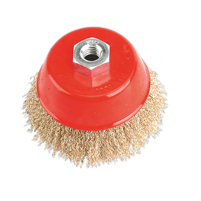 The Sealey Brassed Steel Cup Brush Ø100mm M14 x 2mm - CBC100 is a red, cup-shaped wire brush with crimped brassed steel filaments, designed for cleaning or polishing surfaces and featuring a central hexagonal nut for attachment to power tools.