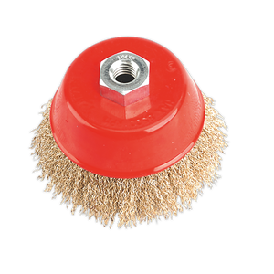 The Sealey Brassed Steel Cup Brush Ø100mm M14 x 2mm - CBC100 is a red, cup-shaped wire brush with crimped brassed steel filaments, designed for cleaning or polishing surfaces and featuring a central hexagonal nut for attachment to power tools.