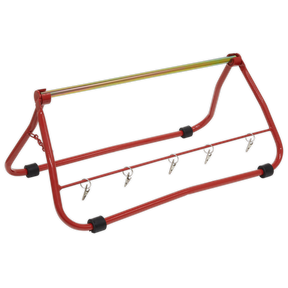 The Sealey Cable Carrier Stand Multi Reel Dispenser - CC01 is a red and black foldable stand with four hooks, ideal for mounting on a vehicle. It includes additional support to efficiently handle wire reels.