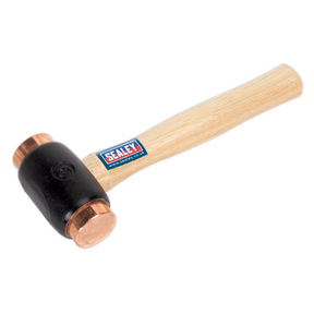 The Sealey Copper Faced Hammer 4.3lb Hickory Shaft - CFH04 is a professional-grade tool featuring a hickory handle with a blue and red Sealey logo sticker, and a black head equipped with pure electrolytic copper faces. Ideal for professional use, this hammer stands out as an excellent choice among Premier Hand Tools.