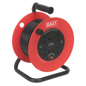 A Sealey Cable Reel 25m 4 x 230V 1.5mm² Heavy-Duty Thermal Trip - CR25/1.5 in red and black, featuring multiple power sockets and a wound-up cable, is sitting on a black stand. This model comes with an impact-resistant drum and offers thermal overload protection for added safety.