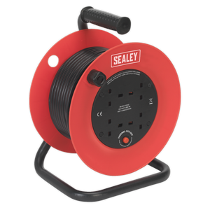 A Sealey Cable Reel 25m 4 x 230V 1.5mm² Heavy-Duty Thermal Trip - CR25/1.5 in red and black, featuring multiple power sockets and a wound-up cable, is sitting on a black stand. This model comes with an impact-resistant drum and offers thermal overload protection for added safety.