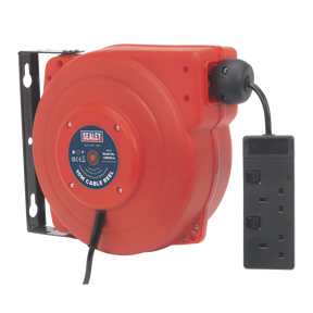 A Sealey Cable Reel System Retractable 10m, model CRM10, with two 230V sockets attached. The red cable reel, which includes a thermal trip switch for safety, is mounted on a black bracket.
