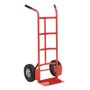 The Sealey Sack Truck with Pneumatic Tyres 200kg Capacity - CST986 is a red and black hand truck with a tubular steel frame, featuring two large black pneumatic tyres and a flat base for lifting and transporting items.