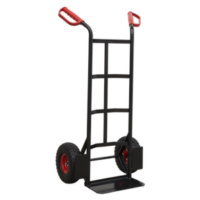 The Sealey Heavy-Duty Sack Truck with PU Tyres 250kg Capacity - CST986HD, featuring a black frame, red handles, and red wheels with durable polyurethane tyres, stands upright on a white background.
