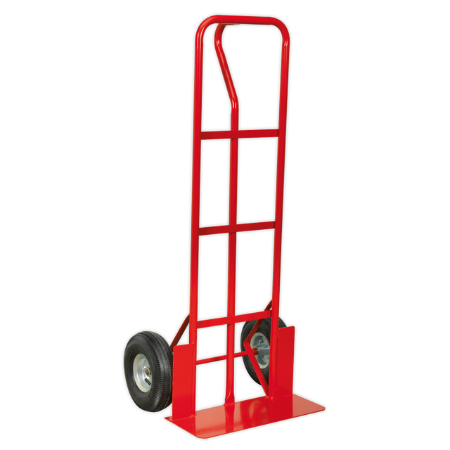 The Sealey Sack Truck Pneumatic Tyres 250kg Capacity - CST988, featuring a red steel frame and two pneumatic tires, is perfect for moving heavy objects over uneven surfaces.