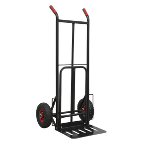 The Sealey Heavy-Duty Sack Truck with PU Tyres (300kg Capacity - CST990HD) comes in black and features red handles, solid polyurethane tyres, and a foldaway toe plate.
