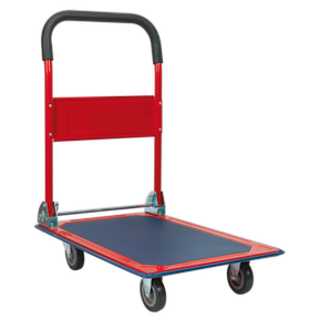 Sealey's CST991 Platform Truck 150kg Capacity features a red and black design with four wheels, a rubberized deck, and fold-flat handles for easy storage.