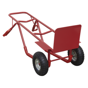 The Sealey Sack Truck with Pneumatic Tyres 300kg Capacity - CST999 features a bright red metal frame and two durable black wheels, specifically designed for lifting and transporting heavy objects across uneven surfaces. Its air-filled pneumatic tires ensure smooth and effortless movement.