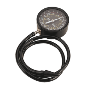 The Sealey Pressure Tester Vacuum/Fuel - CT952 is a black circular mechanical pressure gauge with a dial and attached hose, coiled in a loop, ideal for diagnosing valve problems.