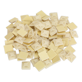 A pack of Sealey Self-Adhesive Cable Tie Mounts, 20 x 20mm in white (Product Code: CTM2020W), designed to accept ties up to 5mm in width, is arranged on a white surface.