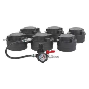 Six black plastic containers with attached metal fittings are arranged around the Sealey Turbo System Leakage Tester - Commercial - CV2030, which includes a pressure regulator with a pressure gauge, hose, and red lever. The regulator, commonly used in heavy commercial vehicles' turbo/intercooler systems, features a green and white stripe on the hose.