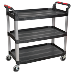 The Sealey Workshop Trolley 3-Level Composite - 3 Wall - CX310 features three black shelves, silver supports, and red handles on four large castors, making it an ideal choice as a versatile garage workshop trolley or janitorial trolley.