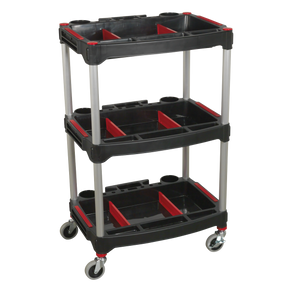 Introducing the Sealey Workshop Trolley 3-Level Composite with Parts Storage - CX313, a sleek black and red trolley featuring three-tier shelves, robust aluminium corner posts, and silver metal legs. Designed for easy mobility with swivel casters.