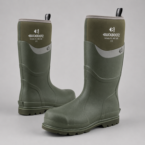 A pair of Buckbootz mid-calf rubber boots in olive green, displayed on a neutral light gray background. One boot is standing upright to show the front branding and side profile, while the other is angled to show the toe and tread.