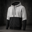 A men's colorblock zip-up hoodie with a light gray upper body and hood, black lower body and sleeves, and a black front zipper, shown against a dark textured studio background.