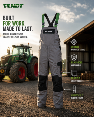 A pair of FENDT work bib overalls in gray and black with green adjustable suspenders, shown standing outdoors in front of a tractor and barn with feature callouts and marketing text.