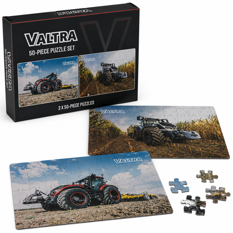 Valtra 50-piece puzzle set shown with its black retail box, two completed tractor-themed jigsaw puzzles, and several loose puzzle pieces on a white background.