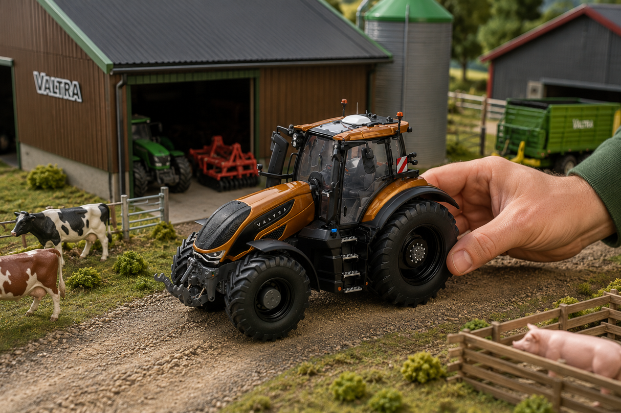 A hand is pushing a detailed orange and black toy tractor on a miniature farm diorama with a barn, cows, and other small farm props.