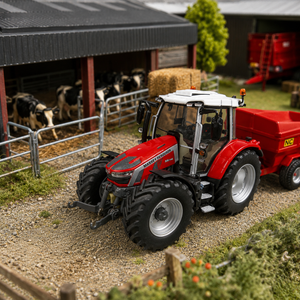 A red and white toy tractor with a black front loader is shown in a detailed miniature farm diorama, positioned next to a red trailer. The diorama includes a barn with cows, hay bales, and a small tree in the background.