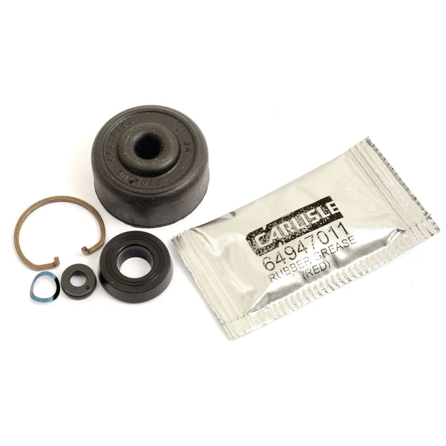 A Clutch Master Cylinder Repair Kit, comprising a metal ring, rubber seals, and a packet of Carlisle rubber grease labeled 64941011. Ideal for Leyland vehicles or as components for a Clutch Master Cylinder from Sparex (Part No. S.52628).