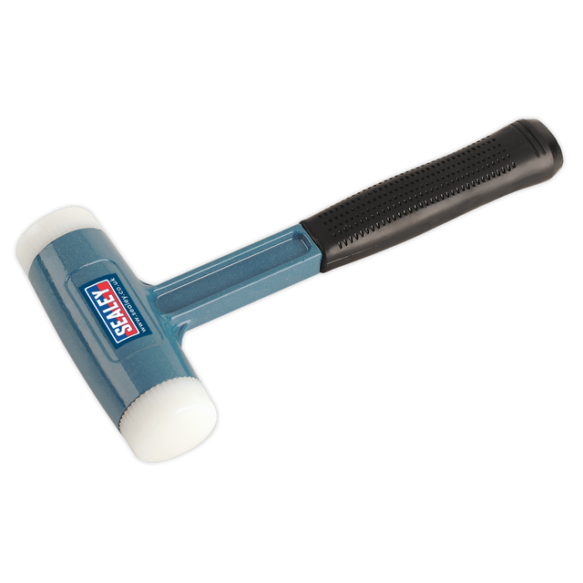 A rubber mallet with a blue and black design, featuring a textured handle for improved grip and dual durable nylon faces, branded with "Sealey" from Premier Hand Tools is visible on the head. This specific model is known as the Dead Blow Hammer 2.5lb Nylon Faced - DBHN275.