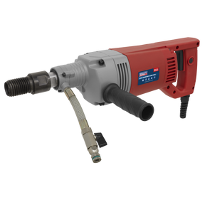 A Sealey Diamond Core Drill 230V - DCD230V, in red and gray, is displayed against a white backdrop. It features a side handle, an attached connection hose, and high-quality components.