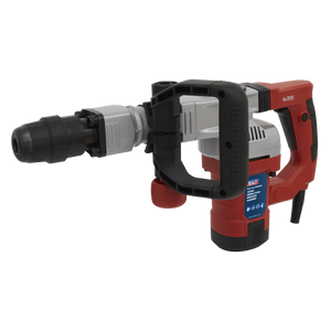 A red and black Demolition Breaker Hammer SDS MAX 1300W/230V - DHB1300 from Sealey, featuring a D-handle grip, an SDS MAX chuck, and a detachable drill bit.