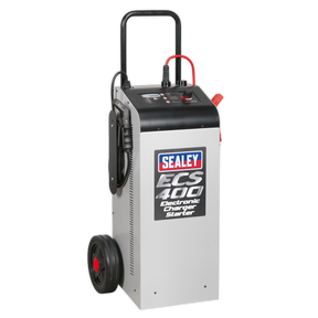 The Sealey Electronic Charger Maintainer/Starter 75/400A 12/24V - ECS400, featuring a handle and wheels for easy portability, is ideal for both 12V and 24V electrical systems. This predominantly gray device with black and red accents ensures stabilized charging current for EFB and AGM/GEL batteries.