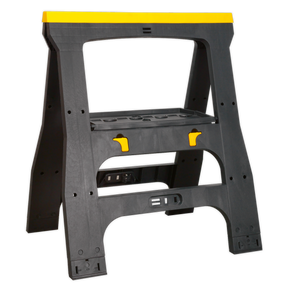 The Sealey Heavy-Duty Folding Composite Trestle - FDT4 is a black and yellow, heavy-duty composite stand featuring a sturdy frame with additional support bars. It includes several notches for holding materials and is conveniently collapsible for easy storage.
